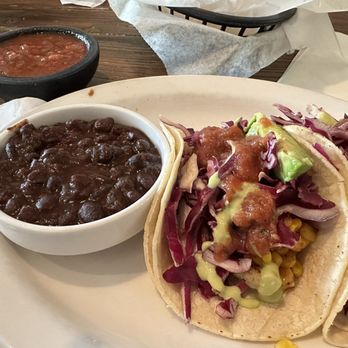 Wicked Cantina Sarasota signature dishes Bar Taco Trio, Wicked Queso, Power Bowl